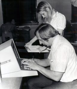 Joseph Denk, founding director of the Academic Computer Center,  with student Donna Newman, 1974-1975